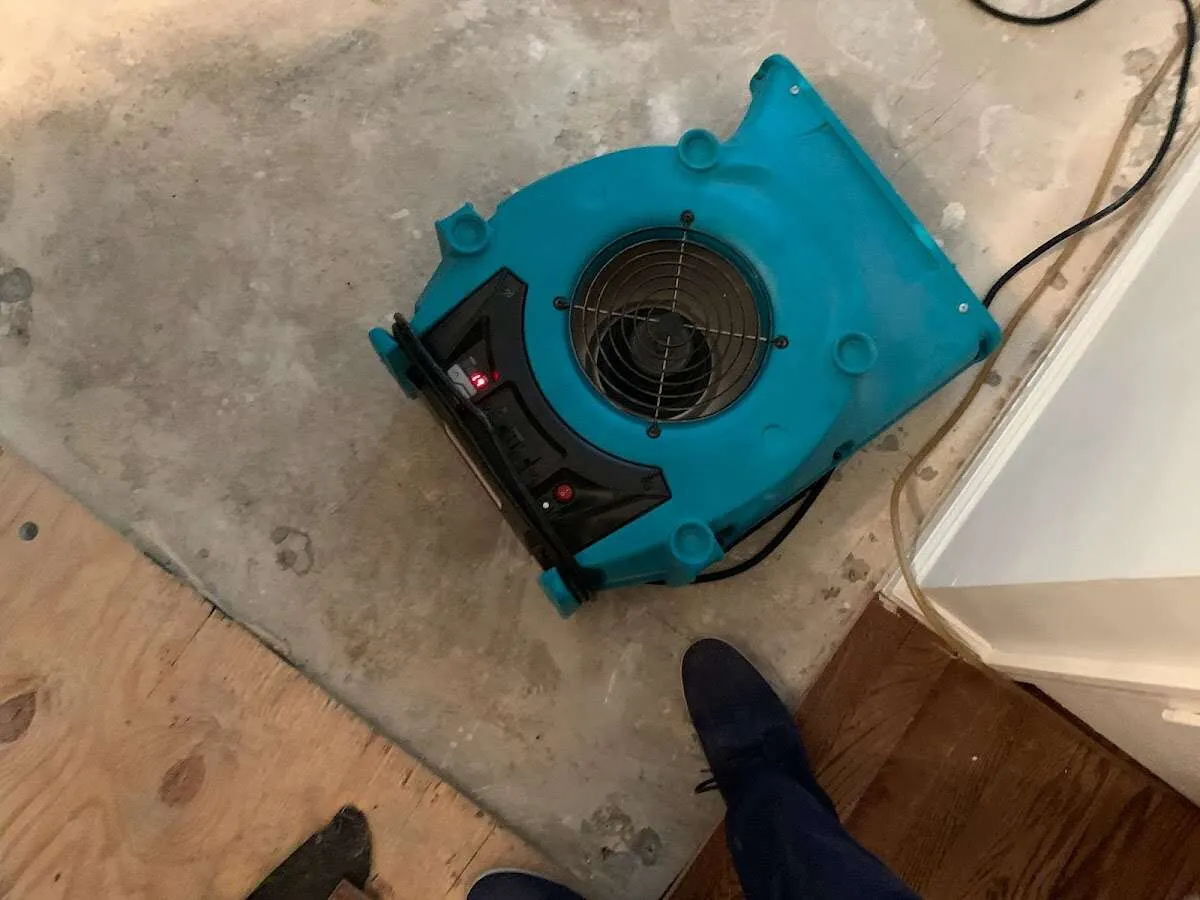 Air mover drying subfloor during Leak Detection & Repair in Libertyville